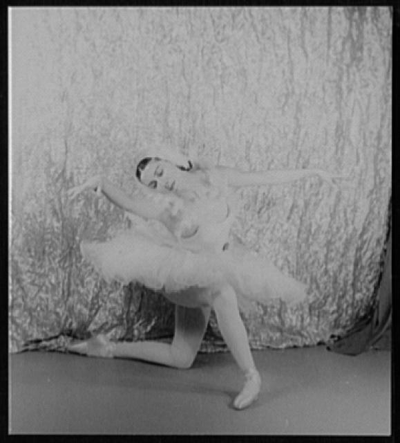Black-and-white portrait of Alicia Markova posed as The Dying Swan in 1948.