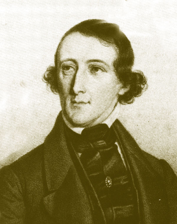 1841 lithographic portrait of August Bournonville standing with one hand at his waist.