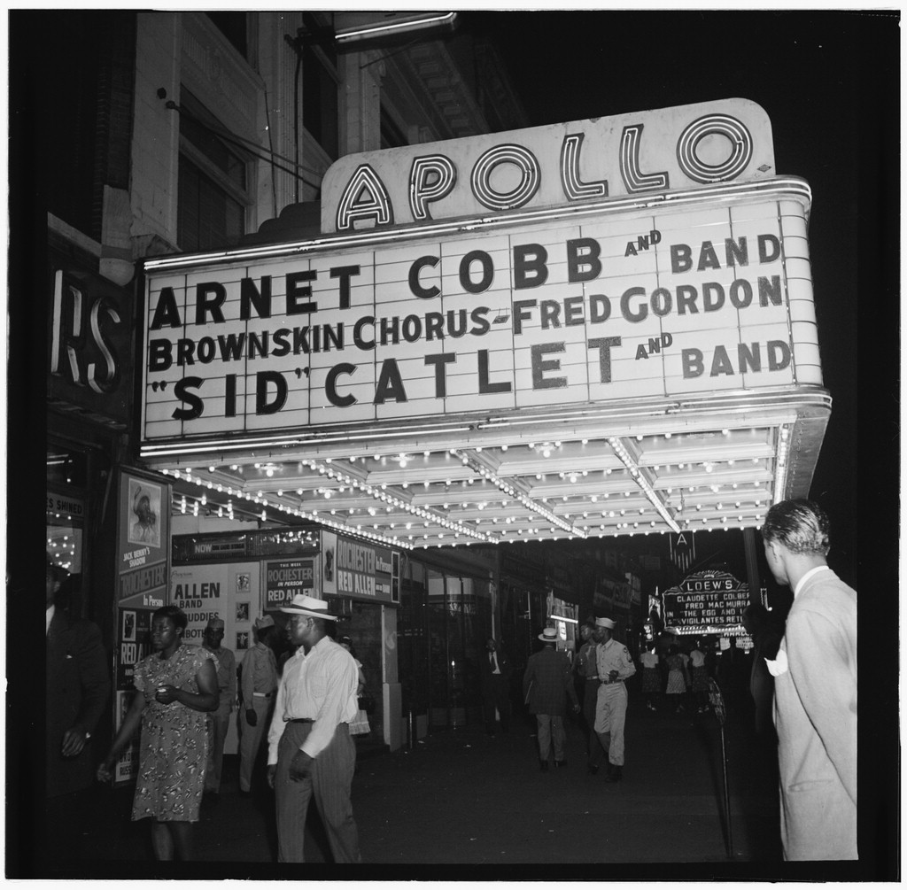 Night view of the Apollo Theatre marquee in Harlem between 1946 and 1948.