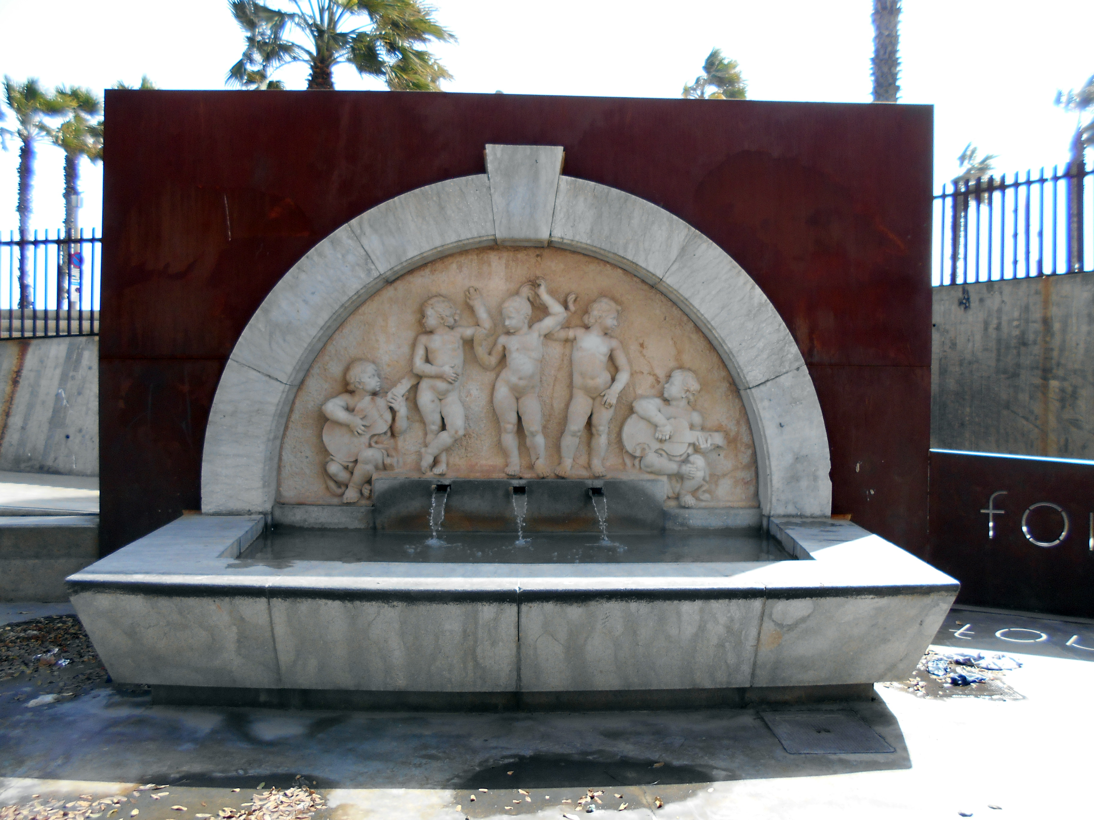 Stone relief fountain dedicated to Carmen Amaya near Barcelona's former Somorrostro district.