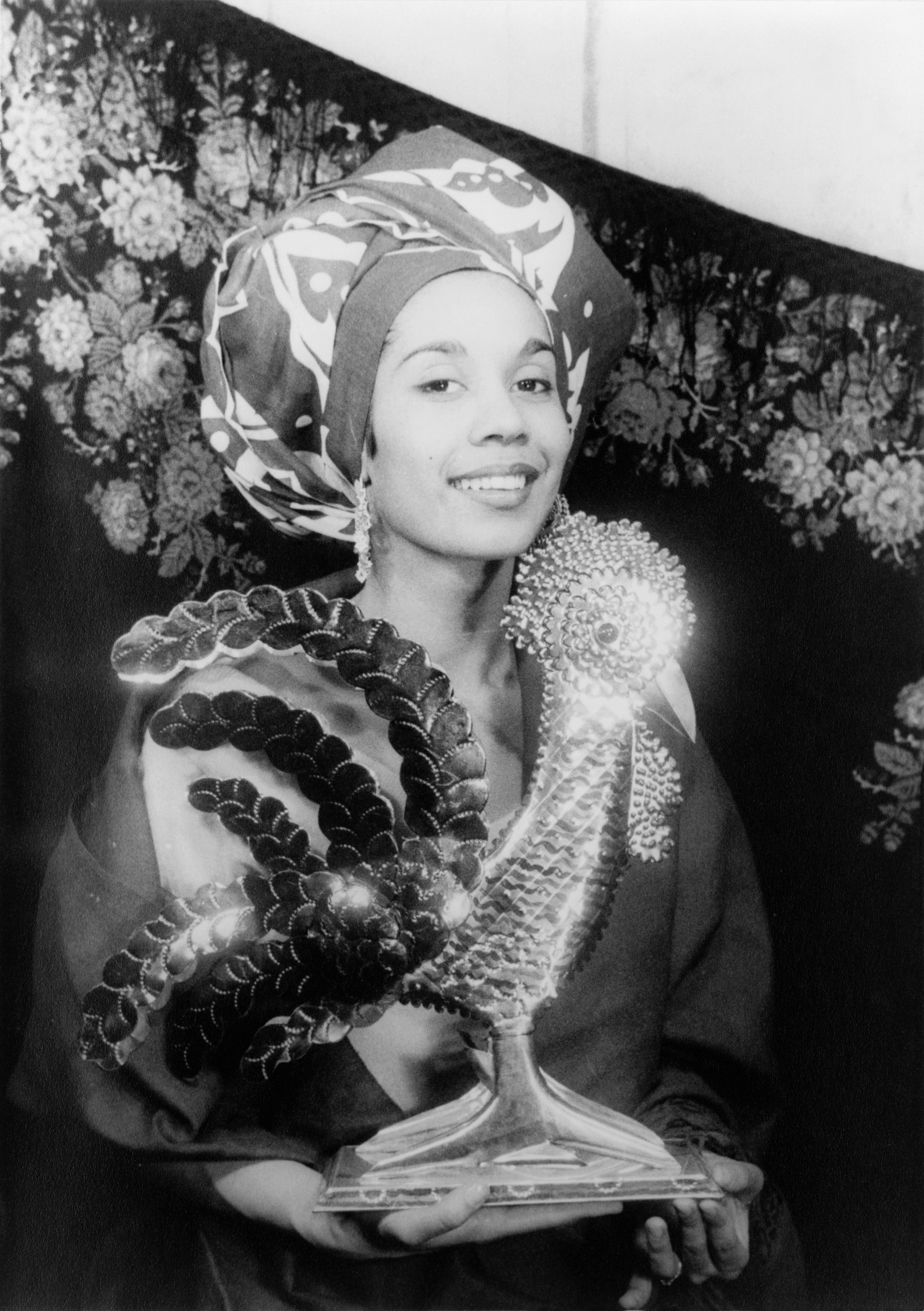 Black-and-white studio portrait of Carmen de Lavallade in 1955, facing right and looking toward the camera.
