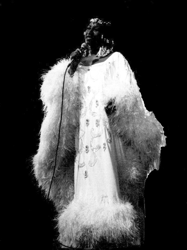 Celia Cruz singing onstage at the Paris Olympia in 1980