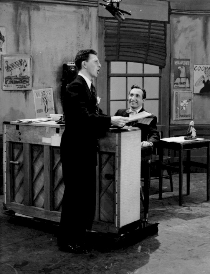 Donald O'Connor standing beside Sid Miller at a piano on The Colgate Comedy Hour in 1952