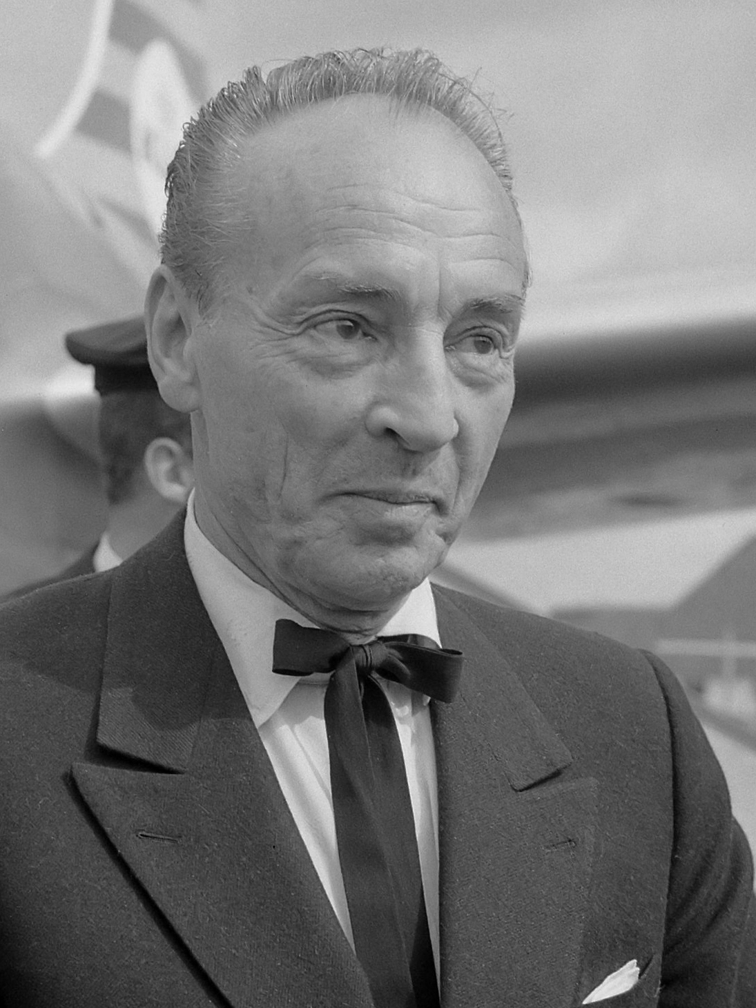 Black-and-white head-and-shoulders portrait of George Balanchine at Schiphol Airport in 1965