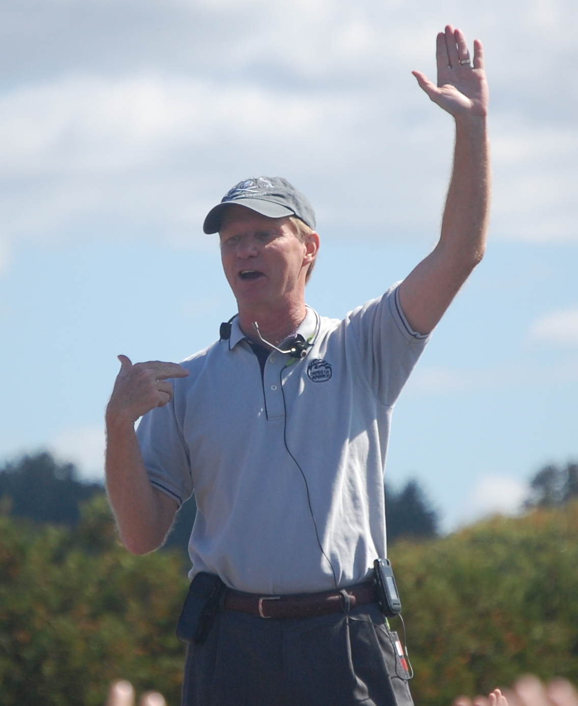 George N. Parks raises one hand while leading UMass Band Day in 2009.