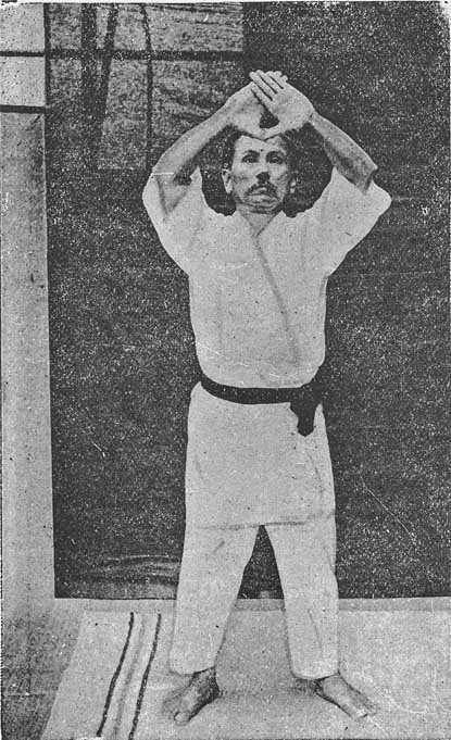 Gichin Funakoshi performing Kanku kata in a 1924 black-and-white photograph