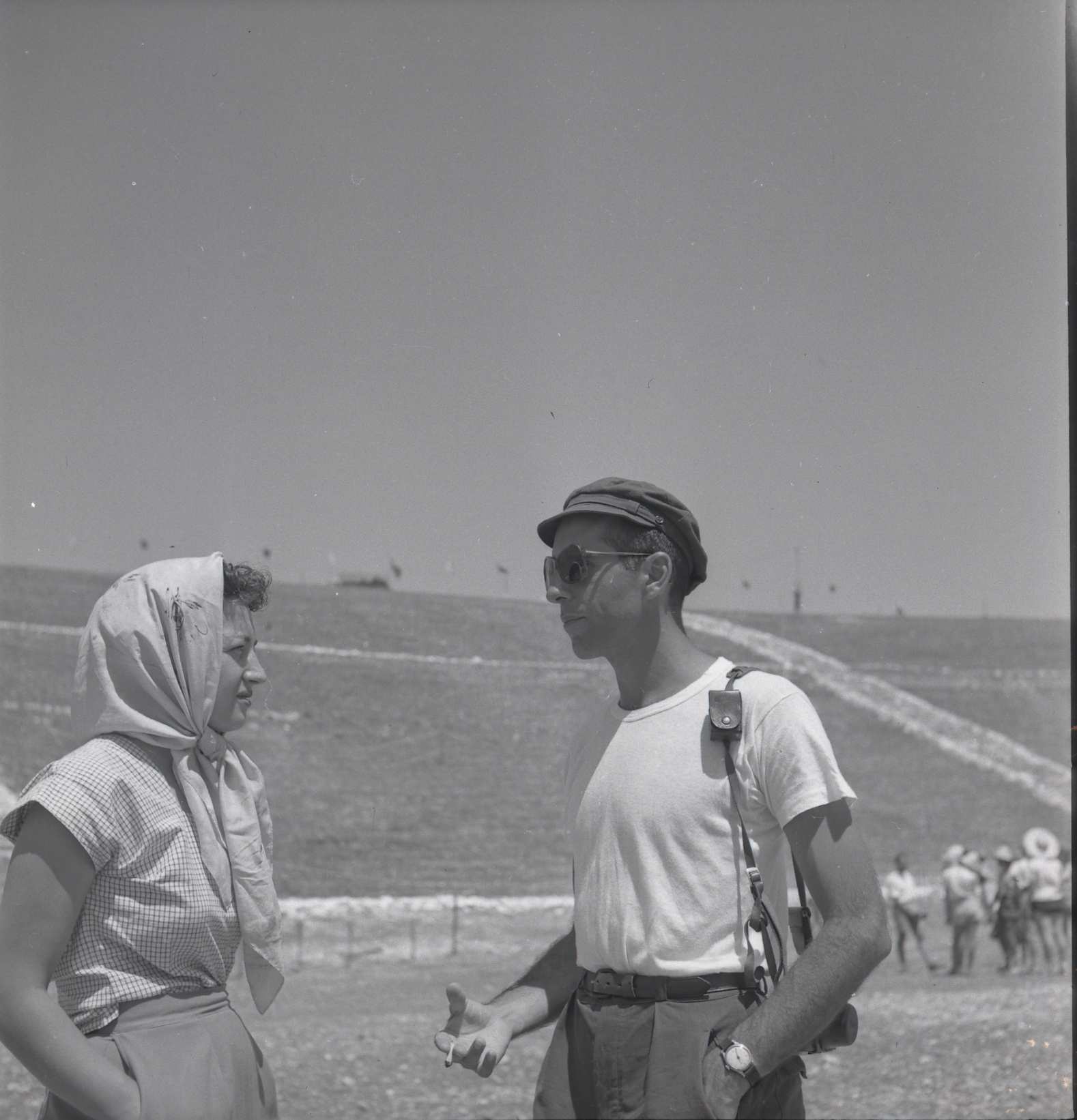 Jerome Robbins speaking with a woman outdoors at Kibbutz Dalia in 1951