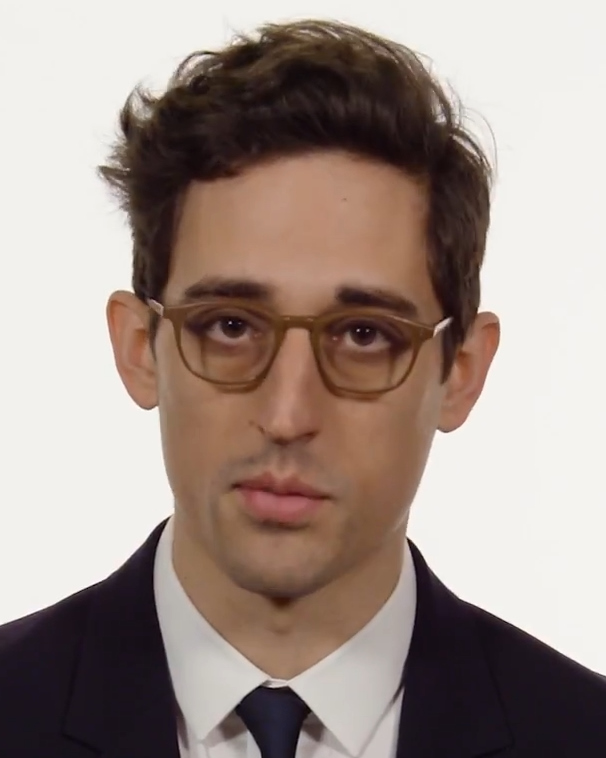Justin Peck in a suit and glasses, photographed in May 2018