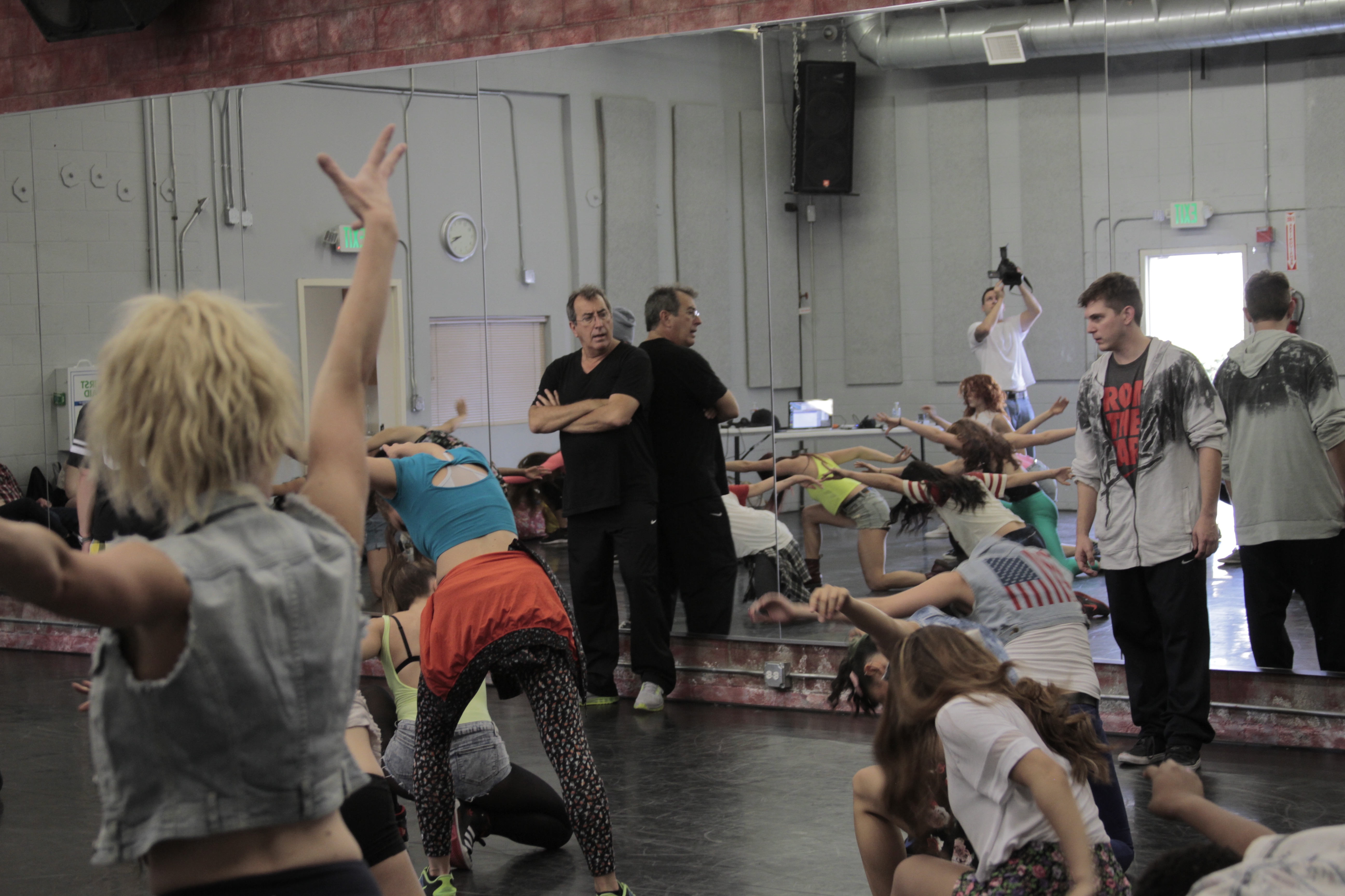 Paul Becker and Kenny Ortega directing dancers during an audition in Los Angeles in 2013