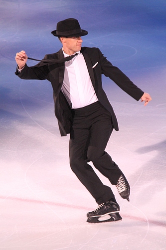 Kurt Browning in a black suit and hat performing at Stars on Ice in Halifax in 2010