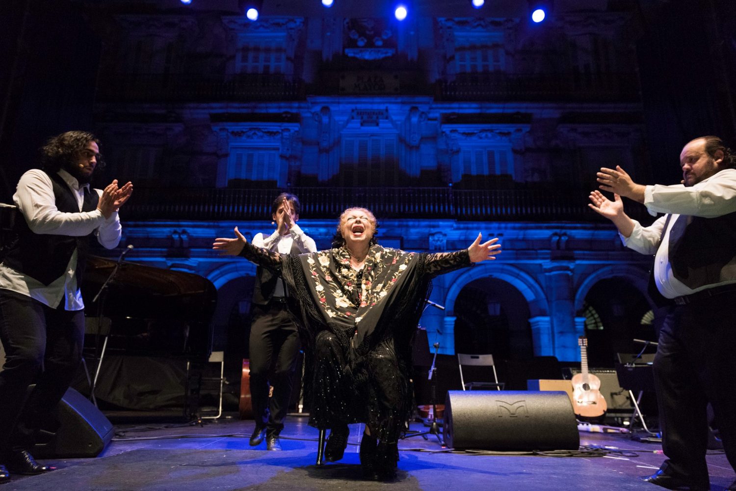 La Chana seated at center during an International Women's Day concert in Madrid in 2018