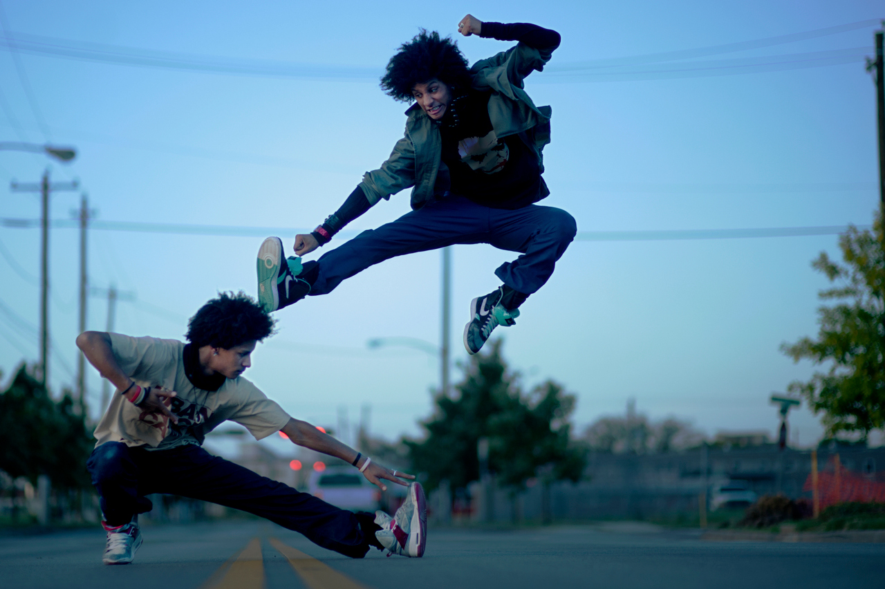 Les Twins performing airborne street-dance movements during a 2010 photo shoot