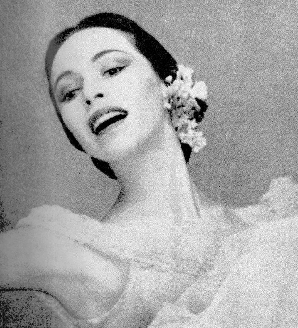 Studio portrait of Maria Tallchief smiling in ballet costume in 1954