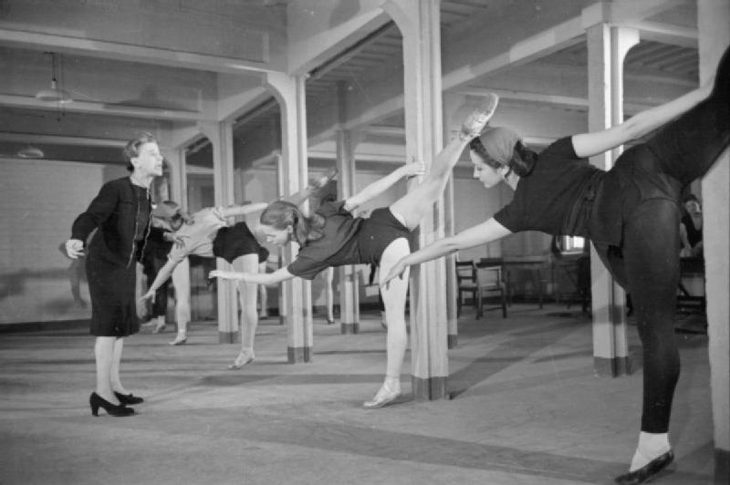 Marie Rambert at left directs Ballet Rambert dancers rehearsing in a factory hostel in 1943