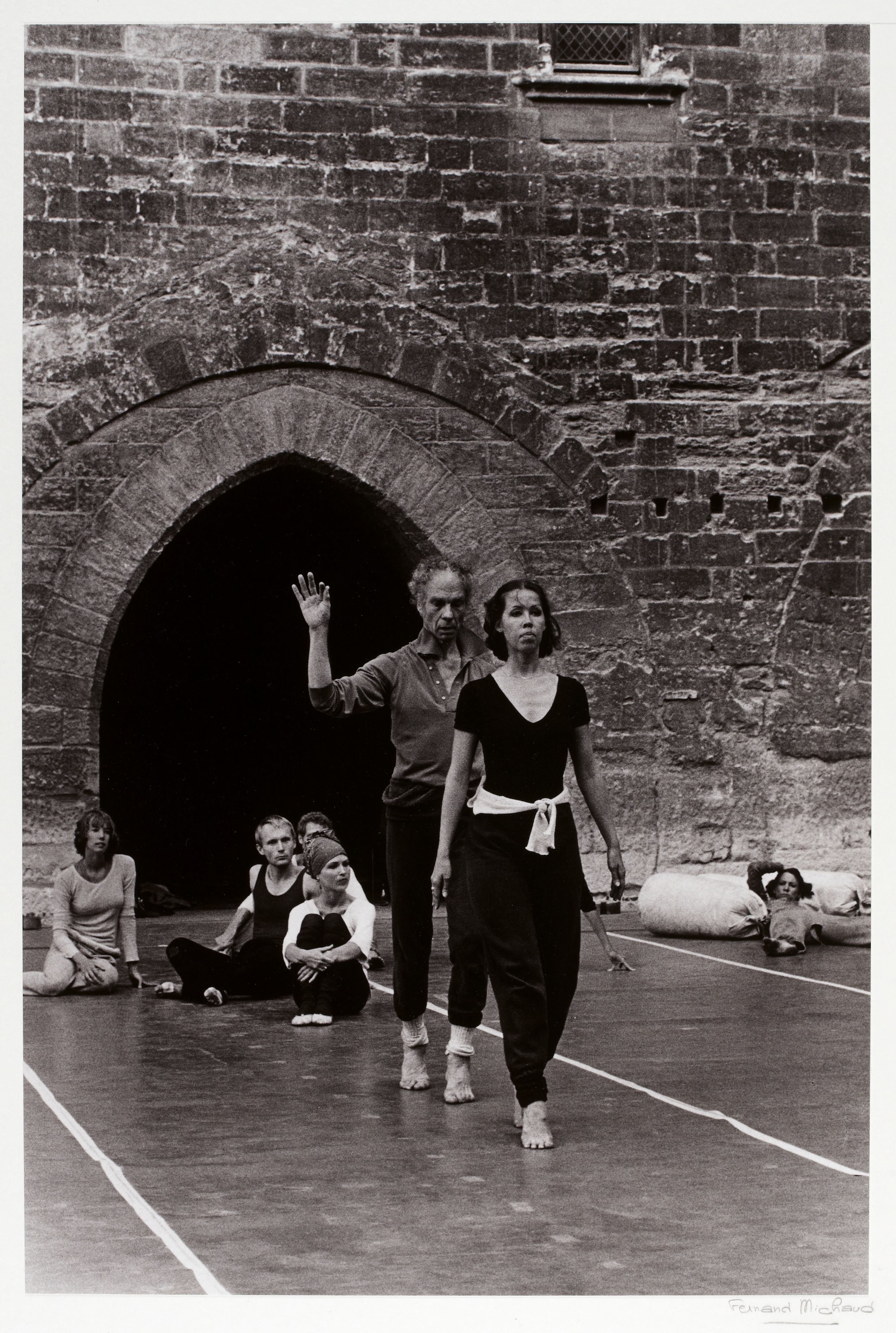 Merce Cunningham rehearsing outdoors with a dancer at the 1977 Festival d'Avignon