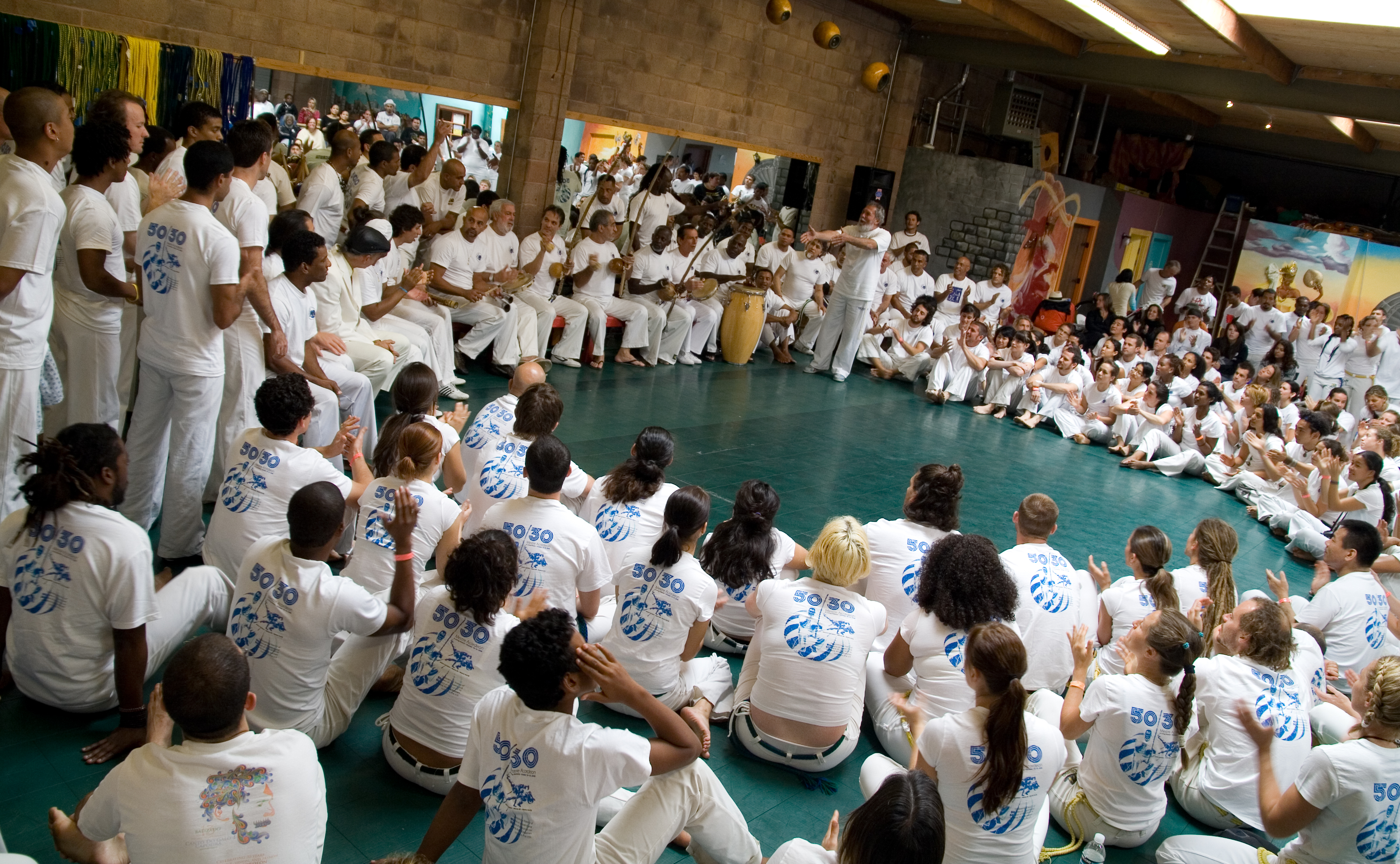Mestre Acordeon standing at a 2008 capoeira celebration