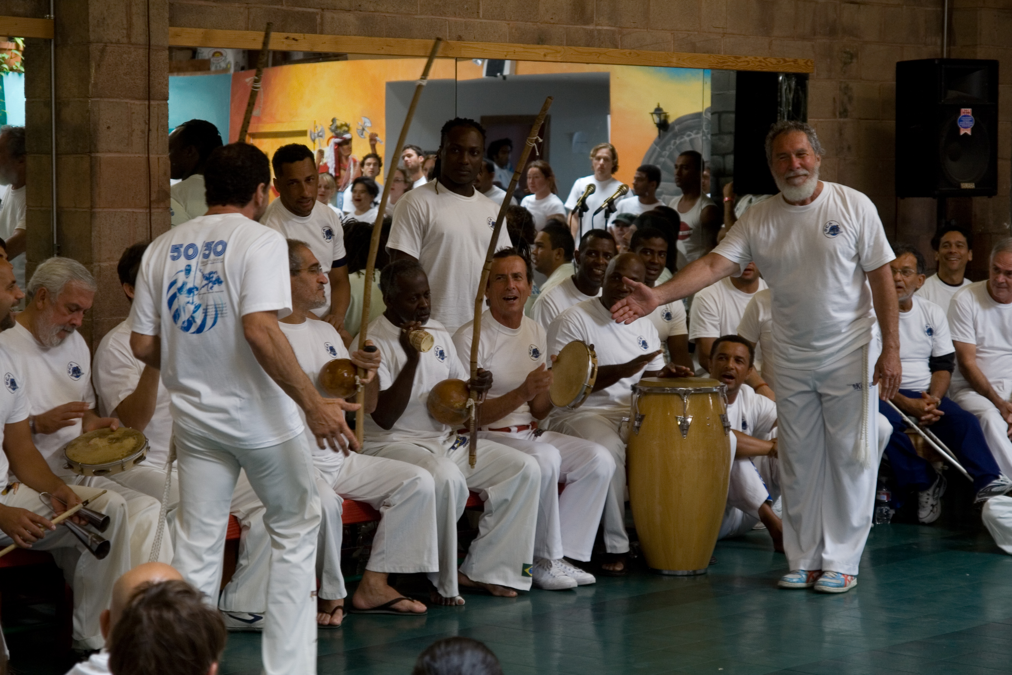 Mestre Acordeon with capoeiristas at a 2008 event