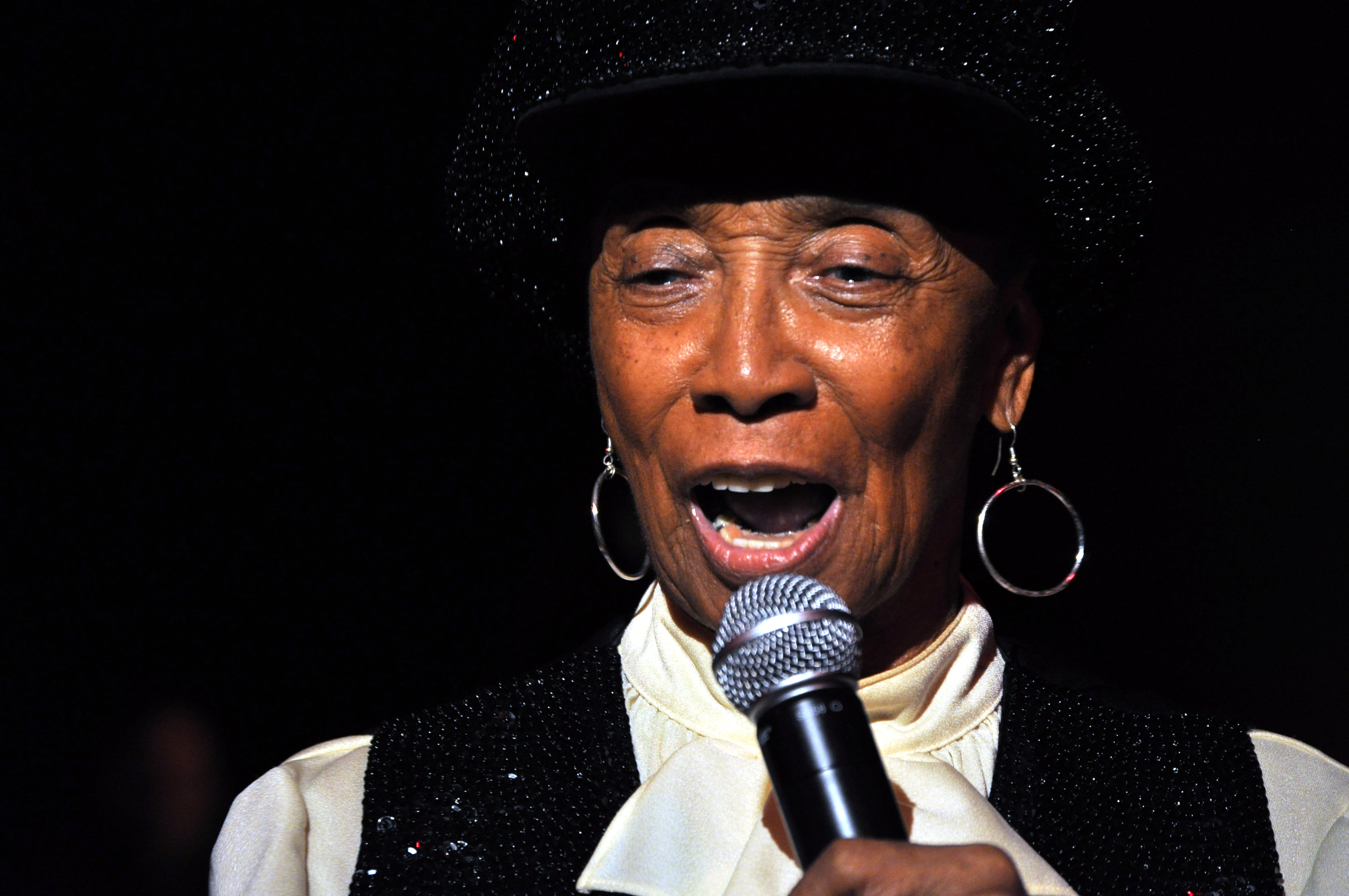 Norma Miller smiling and speaking at the Masters of Lindy Hop and Tap event in Seattle in 2009.