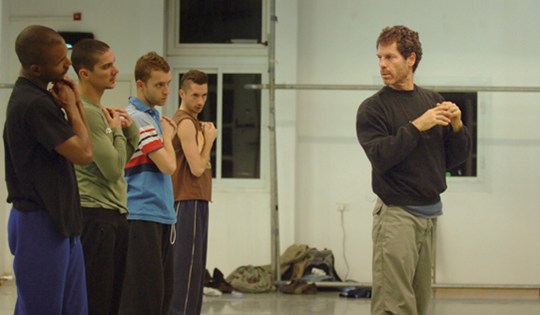 Ohad Naharin demonstrating or giving direction to dancers in a studio, 2009.