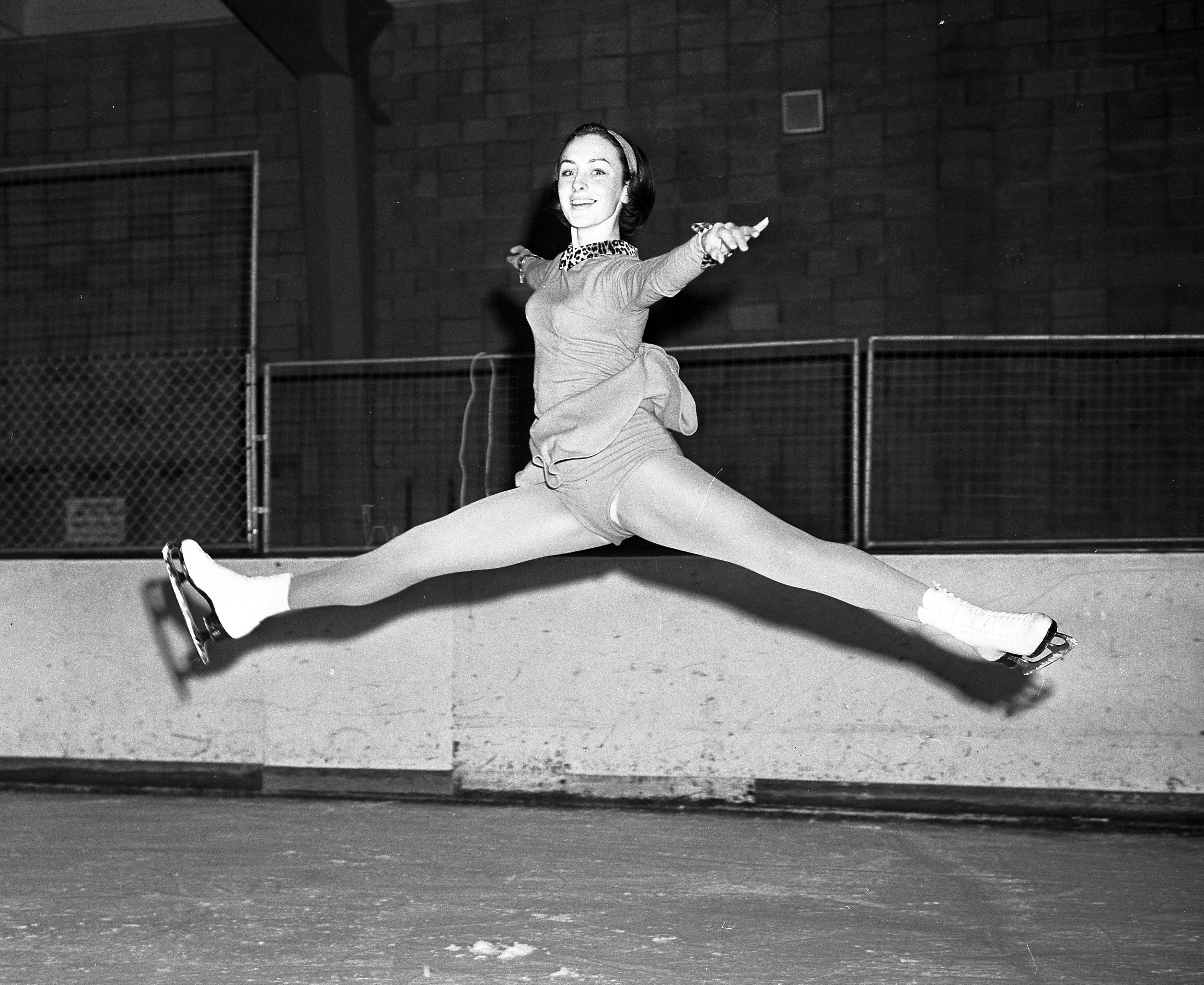 Sixteen-year-old Peggy Fleming executing a split jump during practice in Pasadena in 1965
