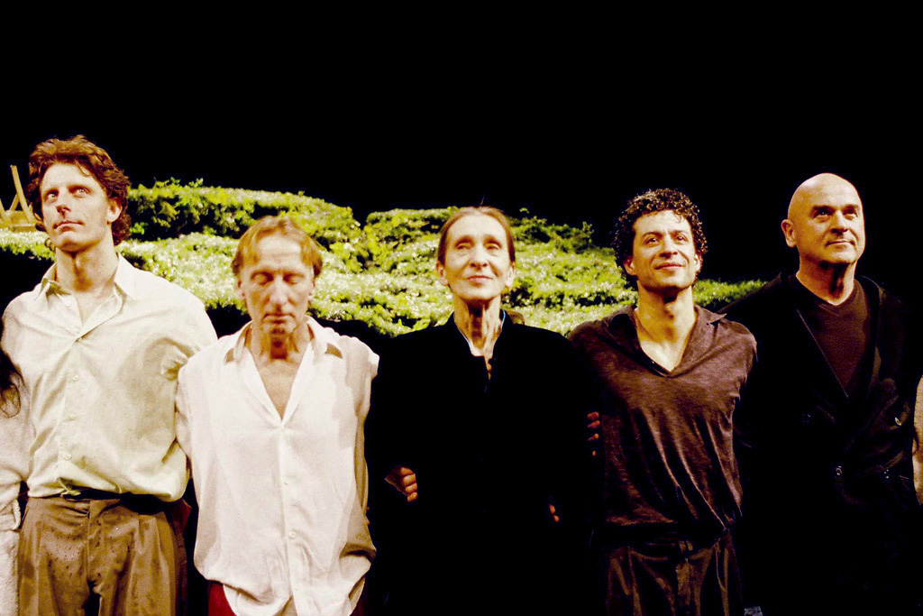 Pina Bausch standing at center with dancers after a performance of Wiesenland in Paris in 2009