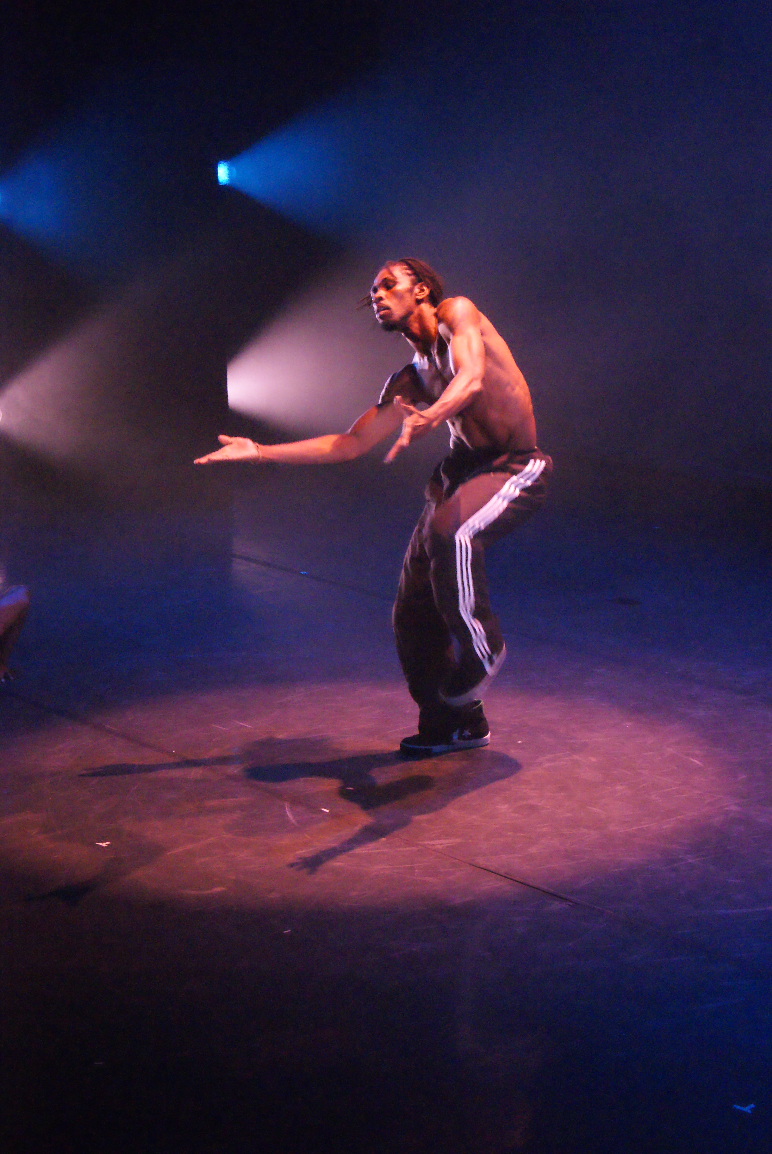 Vertical stage photograph of Rennie Harris Puremovement performing at Teatro de la Ciudad in Puebla in 2010.