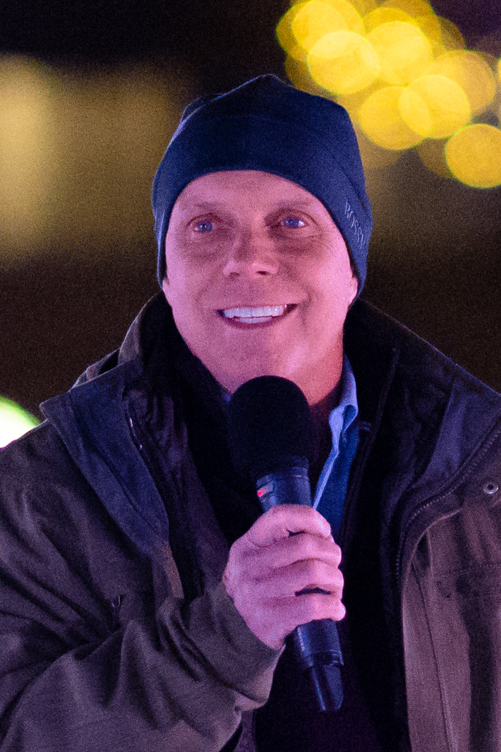 Scott Hamilton speaking at the outdoor rink in Cleveland Public Square in 2022