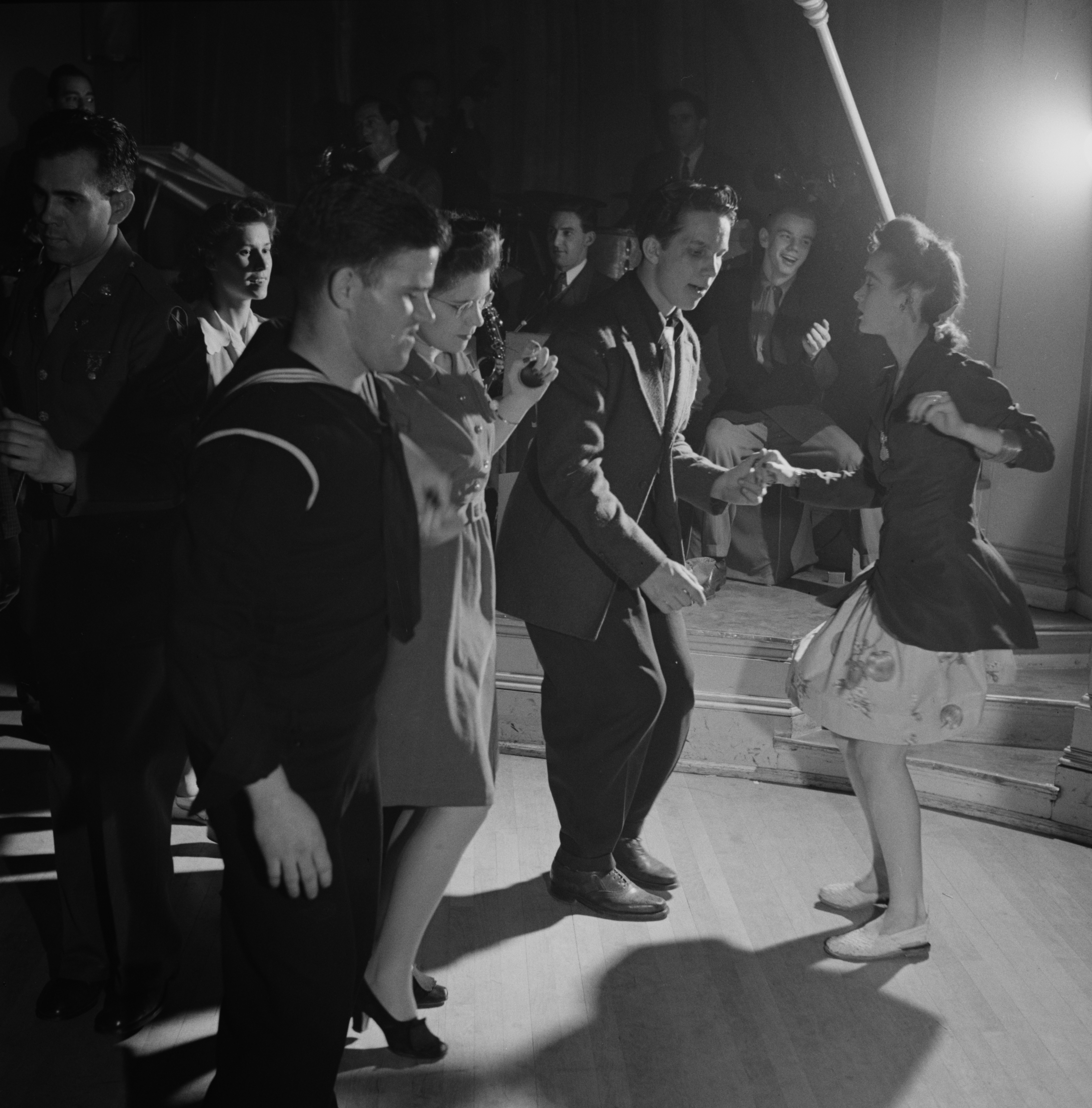 Black-and-white photograph of couples jitterbugging at an Elks Club dance in Washington, D.C., in 1943.