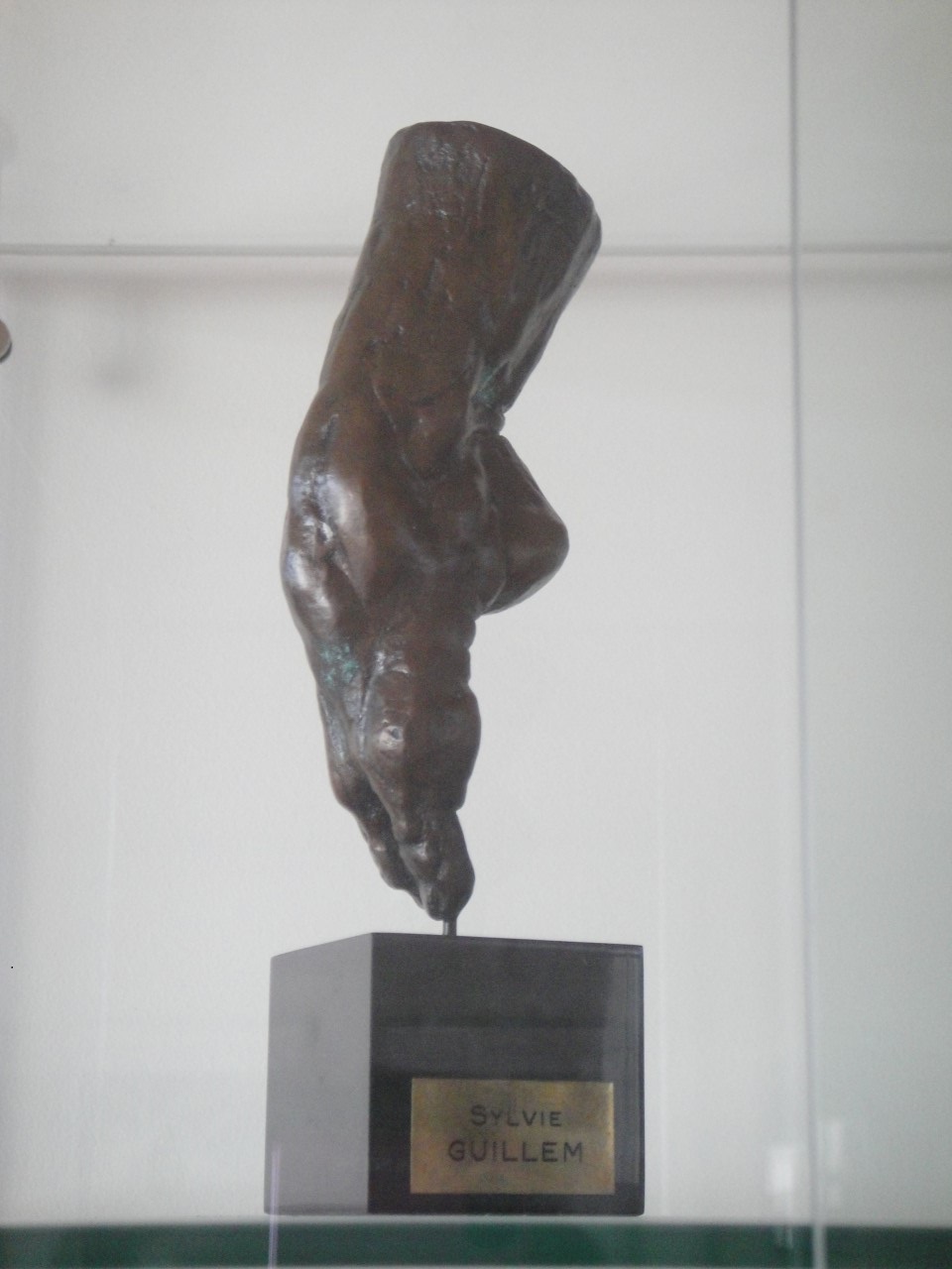 Bronze sculptural cast of the arch of Sylvie Guillem's foot on a labeled plinth