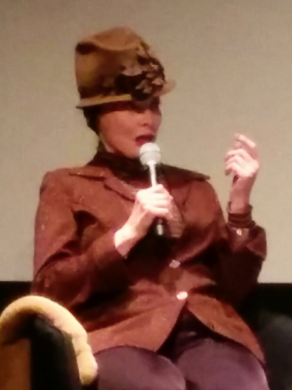 Toni Basil gesturing during a talk at SFMOMA in 2016