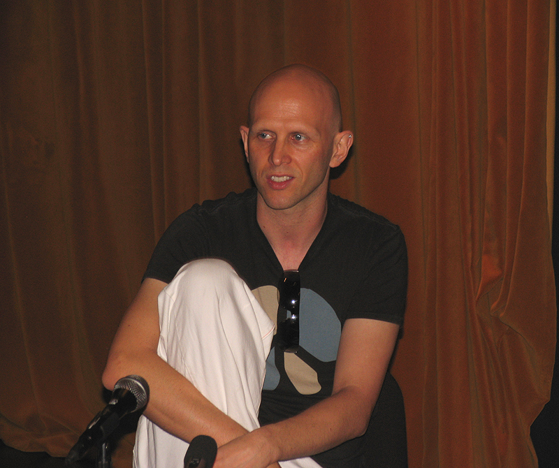 Wayne McGregor speaking at a table during a 2008 cultural event